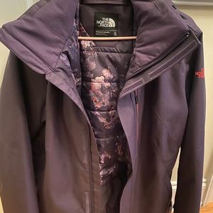 Purple NorthFace jacket.